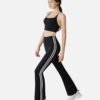 black halter crop top and flared stripe pants