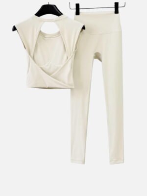 cream cross-back sleeveless top and high-waisted leggings