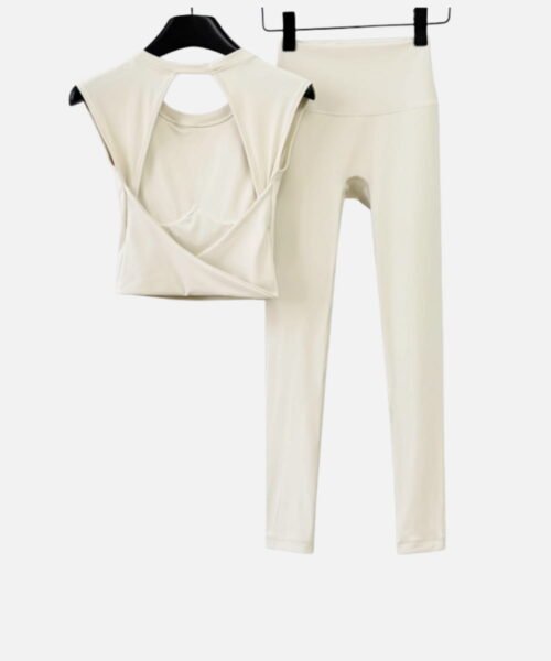 cream cross-back sleeveless top and high-waisted leggings