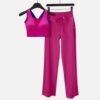 fuchsia sports bra with blue trim and yoga pants
