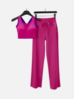 fuchsia sports bra with blue trim and yoga pants