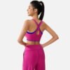 fuchsia sports bra with blue trim and wide leg pants
