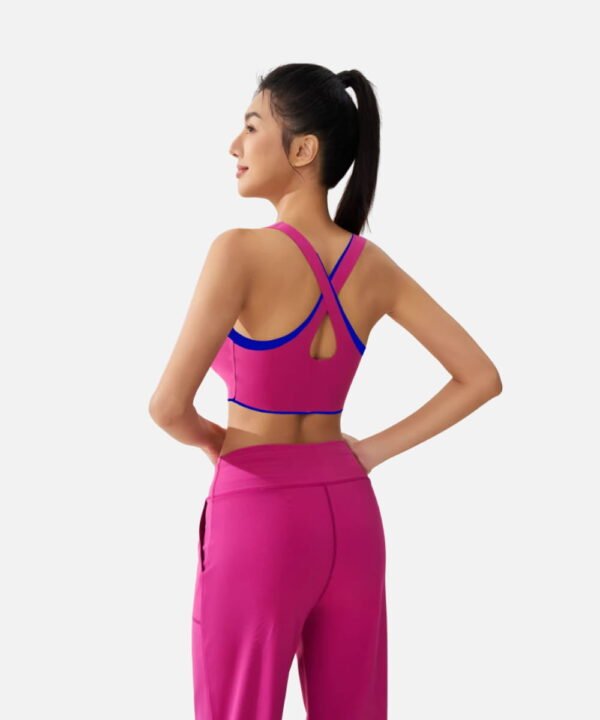 fuchsia sports bra with blue trim and wide leg pants
