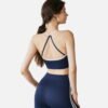 black strappy crop top and flared yoga pants back view