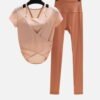 peach wrap mesh top with orange high-waisted leggings