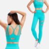 teal mesh sports bra and leggings worn by model