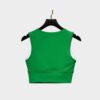 Back view of green sports bra in stretch fabric, seamless design for active gymwear