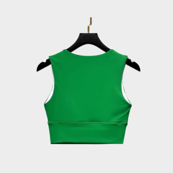 Back view of green sports bra in stretch fabric, seamless design for active gymwear