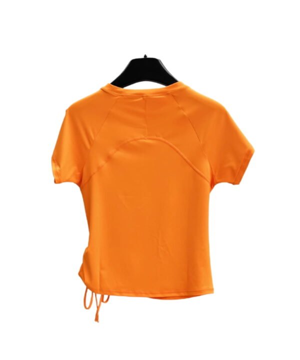 Back view of bright orange gym top with curved stitch design and short sleeves