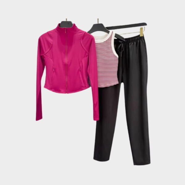 Fuchsia jacket, red‑stripe tank, and black pants; lightweight gym‑to‑street look