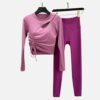 Mauve padded cutout yoga top with side ruching, matched with magenta leggings for training or casual