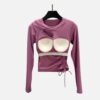 Mauve padded cutout yoga top with side ruching, matched with magenta leggings for training or casual