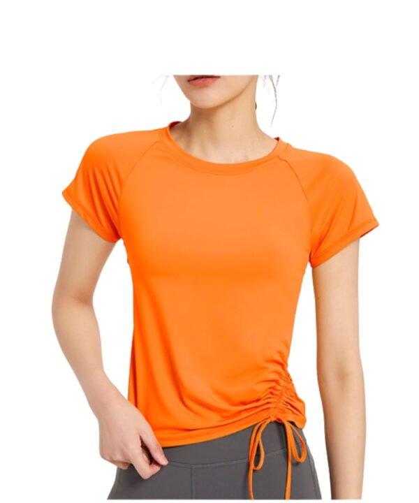 Bright orange active tee with side ruched tie, shown from front on model